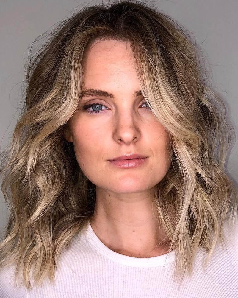 medium length hairstyles women blonde a line lob with face framing layers Luxe Digital