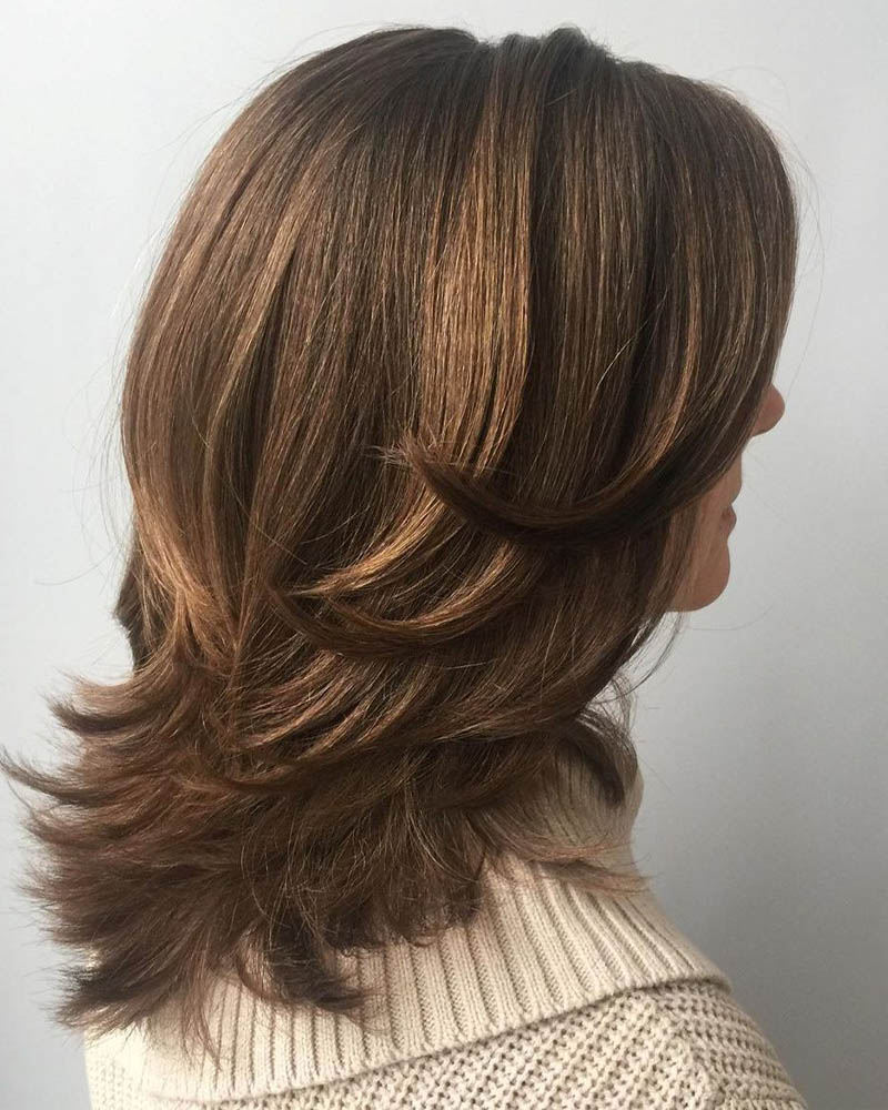 medium length hairstyles women feathered mid length style layers Luxe Digital