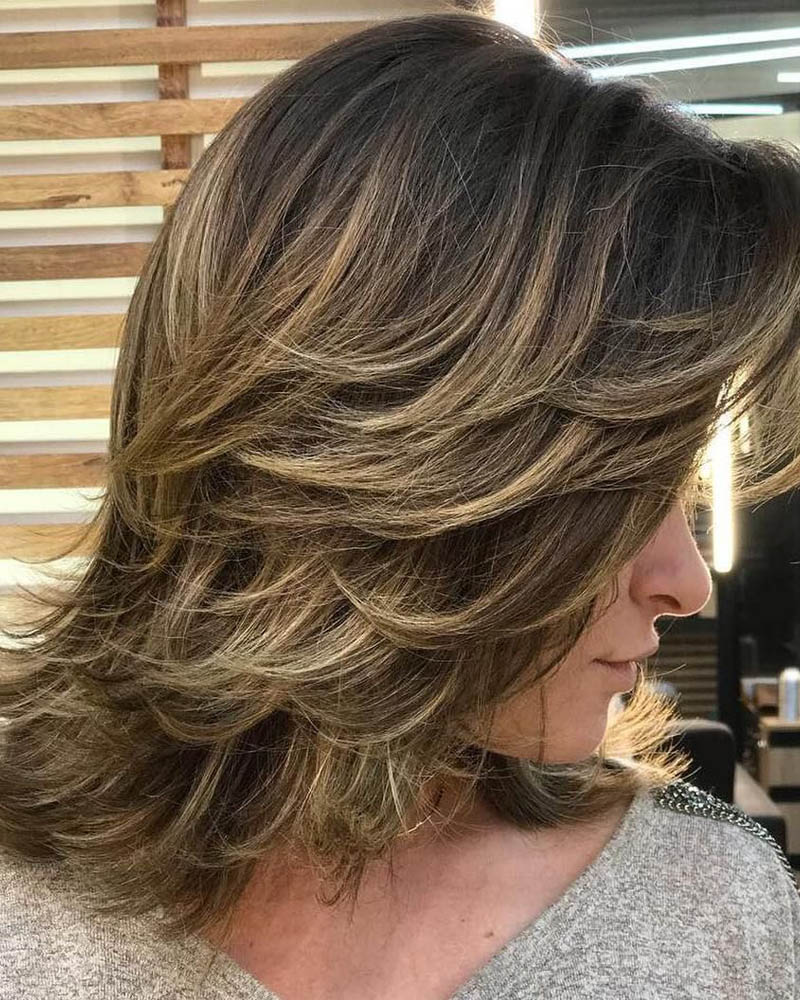medium length hairstyles women feathered mid length style layers Luxe Digital