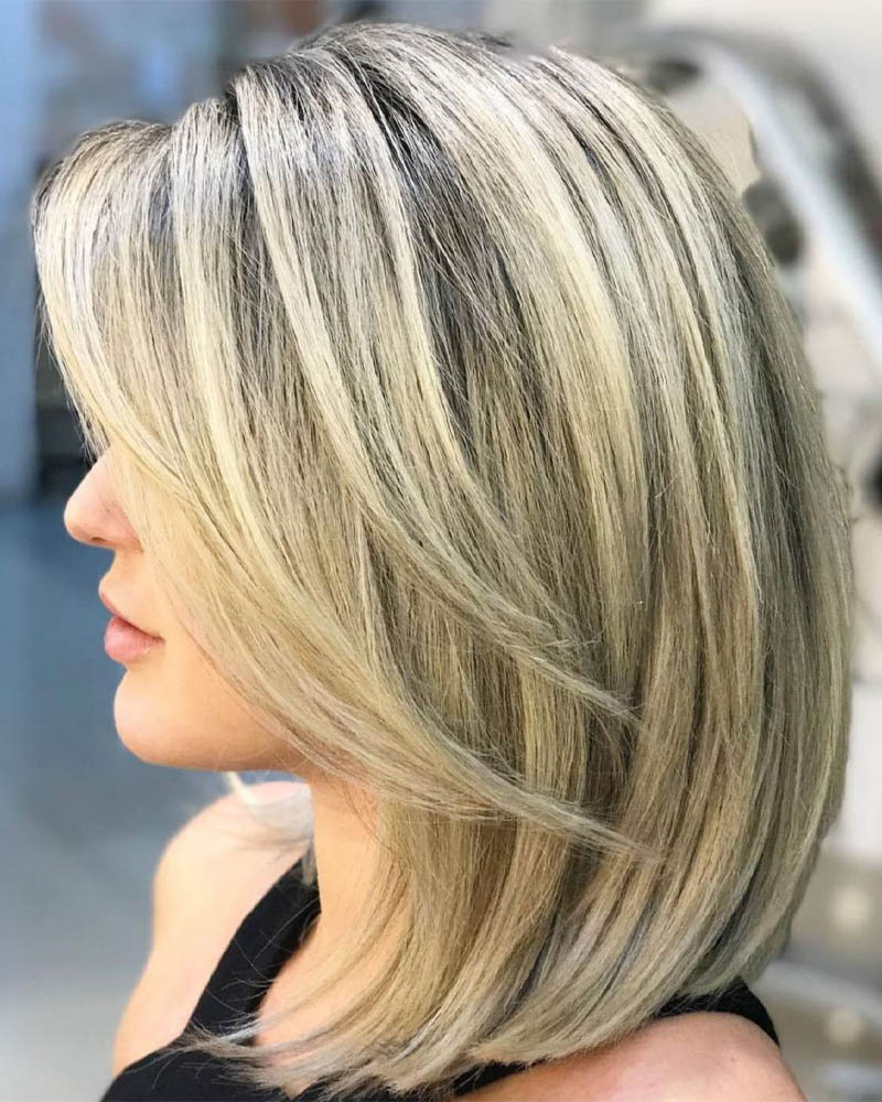 medium length hairstyles women medium blonde hairstyle with v cut layers Luxe Digital