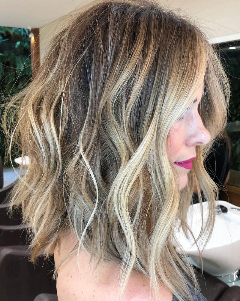 medium length hairstyles women messy wavy lob with disconnected ends Luxe Digital