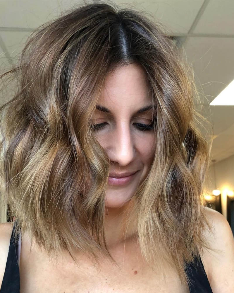 medium length hairstyles women messy wavy lob with disconnected ends Luxe Digital