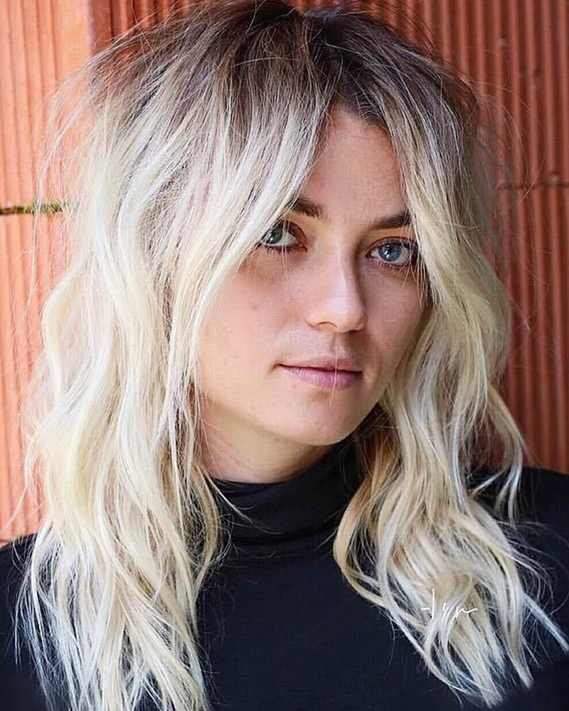 medium length hairstyles women shattered blonde shag with flyaways Luxe Digital