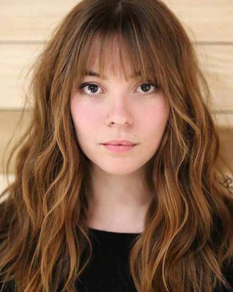 medium length hairstyles women wispy bangs with medium length hair Luxe Digital