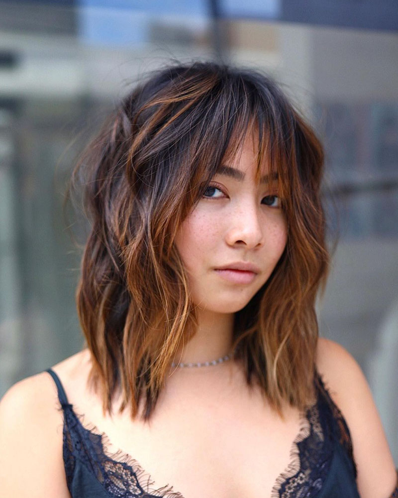 medium length hairstyles women wispy bangs with medium length hair Luxe Digital